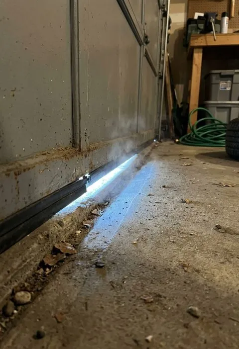 Cold Air Pours In Under the Garage Door and the Repair Company Can’t Come Until After New Year. What Can You Do Right Now?