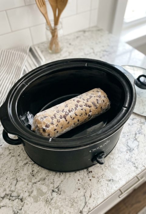 Toss a frozen raw cookie dough log in the slow cooker and 3 other ingredients to get a treat so delicious your family will be begging for more!