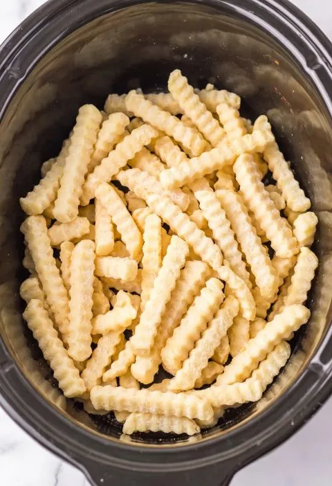 4-Ingredient Slow Cooker Cheesy Onion Fries