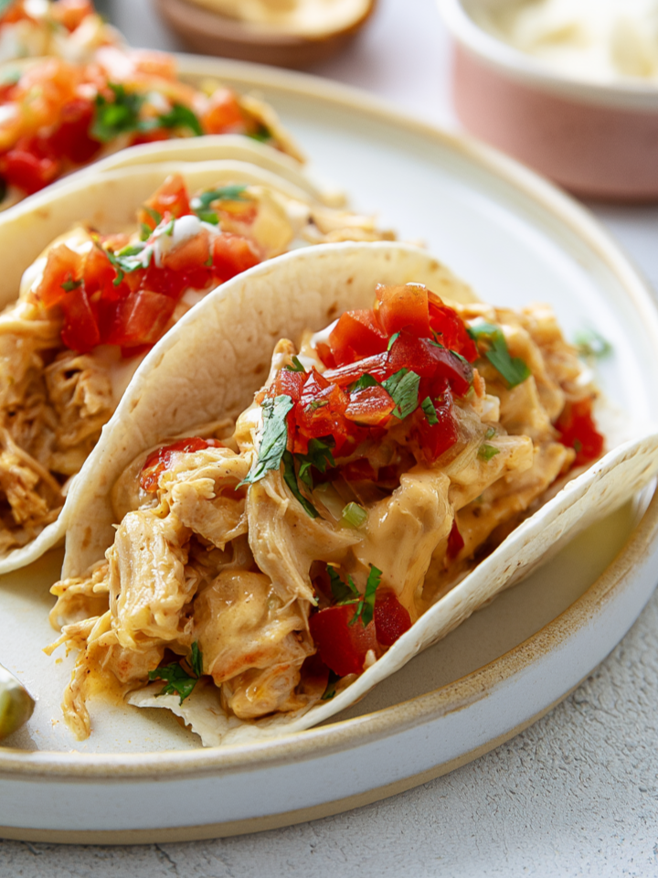 Slow Cooker Queso Chicken Tacos