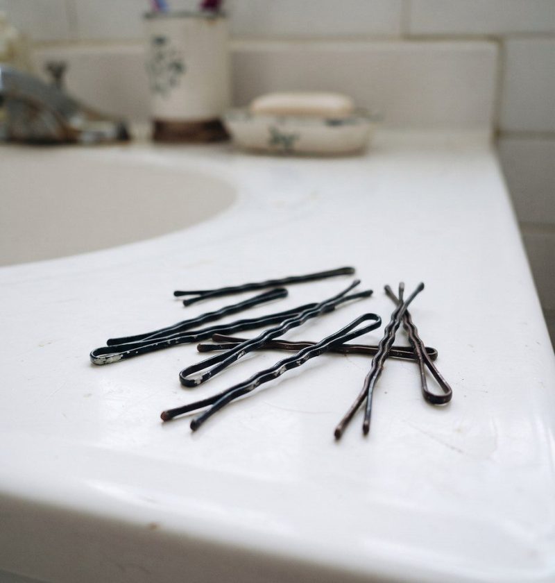 Bobby pins on a bathroom counter showing the wavy side