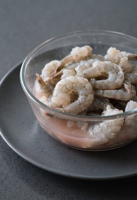 Thawed shrimp in pink liquid