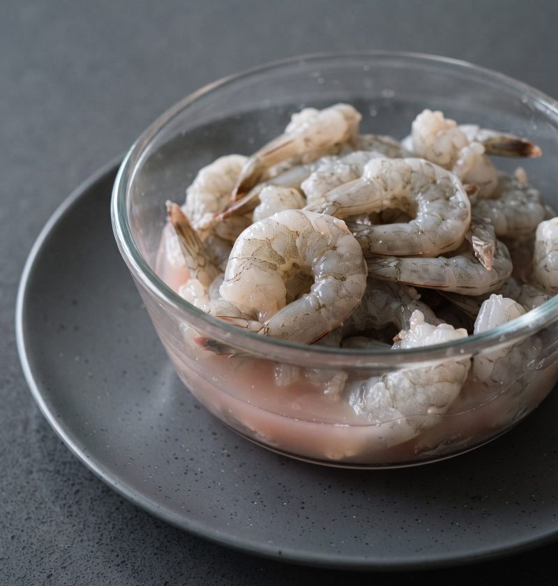 Thawed shrimp in pink liquid