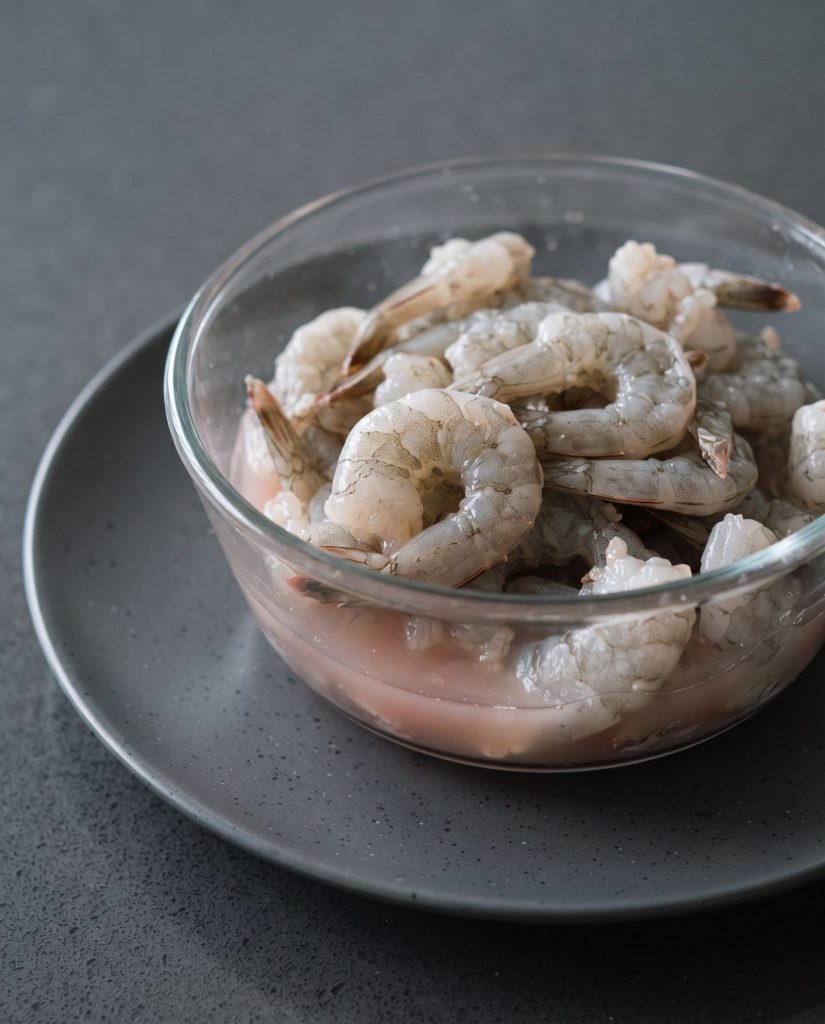 Thawed shrimp in pink liquid